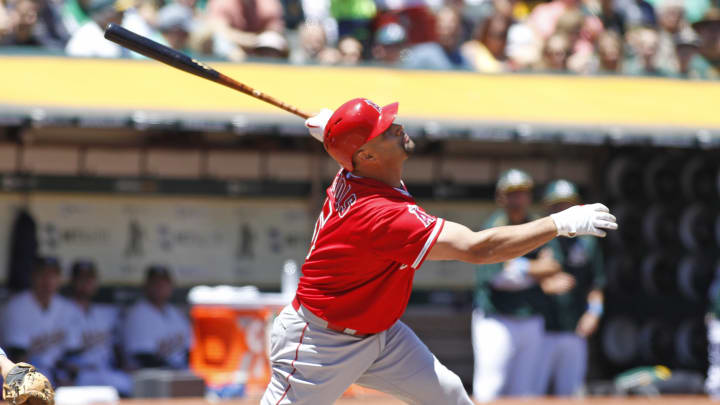 Kazmir pitches into 8th, A's hold off Pujols, Angels 3-2