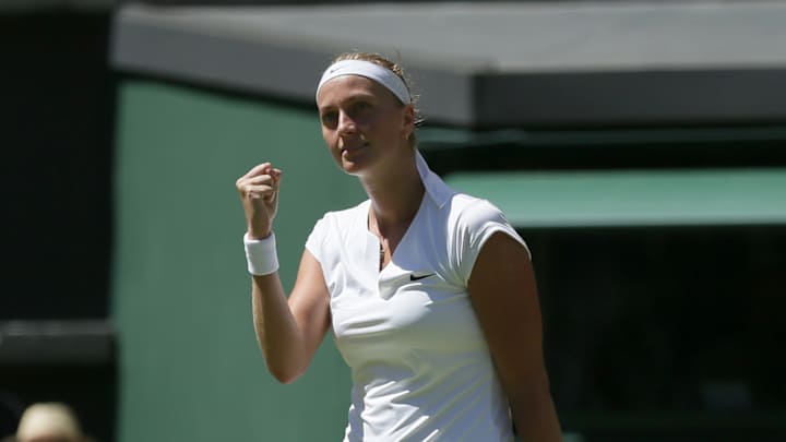 Wimbledon champions advance with ease