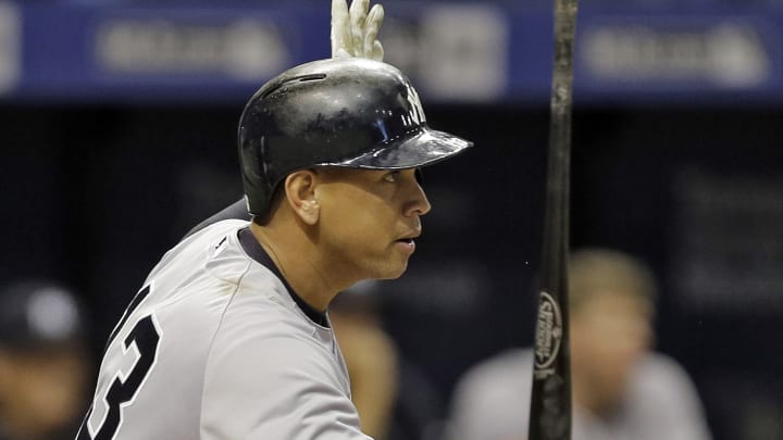 A-Rod playing with bruised knee, homers