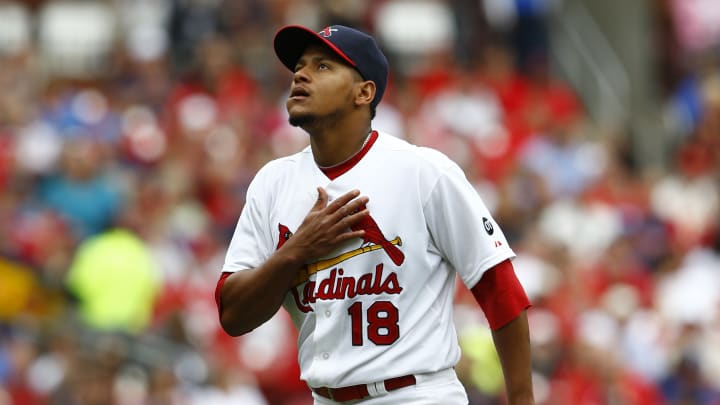Martinez honors late Taveras, pitches Cardinals over Dodgers