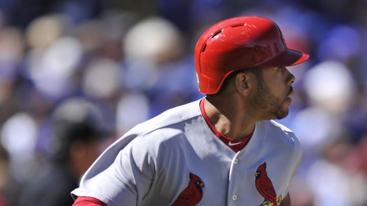 Molina exits with thumb sprain as Cardinals beat Cubs 4-3