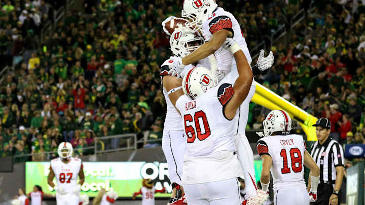 Wilson throws for 4 TDs in 62-20 Utah win over Oregon