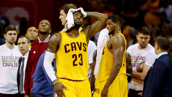 Watch: LeBron James cuts head after flying into baseline cameraman