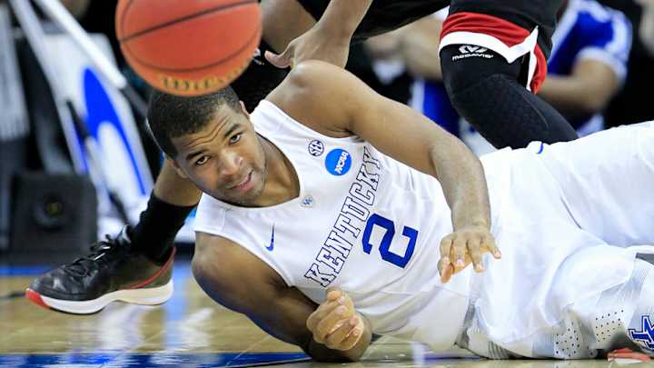 Kentucky players react after win to Daxter Miles's prediction