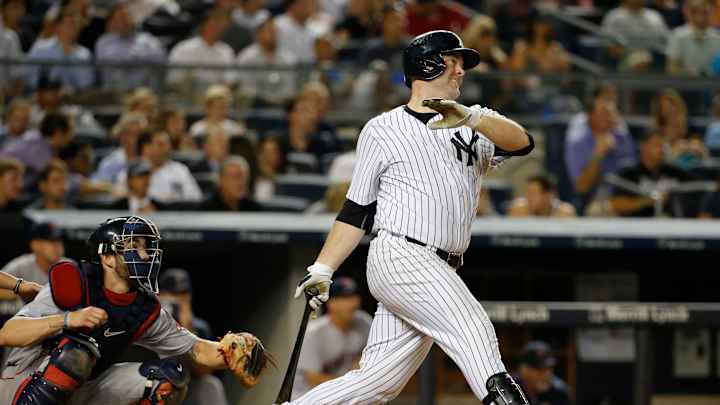 McCann sidelined with stiff knee; Yankees re-sign Jones