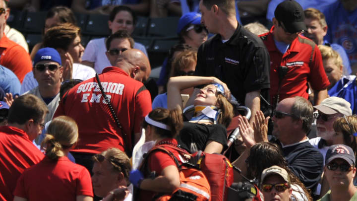 Fan struck by foul ball, taken off on stretcher at Wrigley
