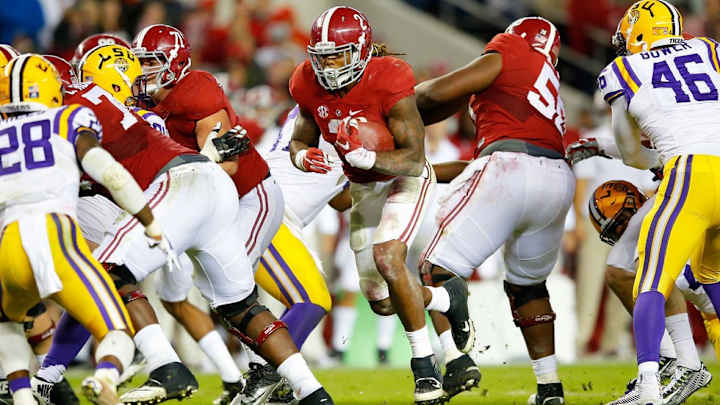 Maximum impact: Derrick Henry hits the hole like a freight train, but that isn't all he brings to Alabama