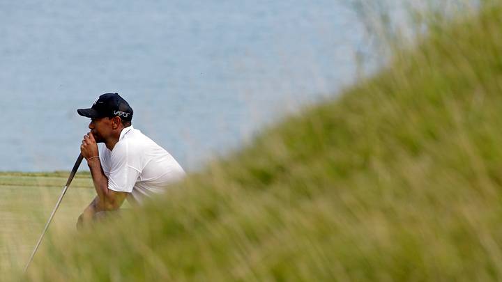 The Latest: Day in the lead, Woods likely heading home