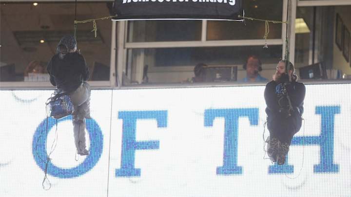 Protesters rappel from upper deck at Monday Night Football game Protesters rappel from upper deck at Monday Night Football game