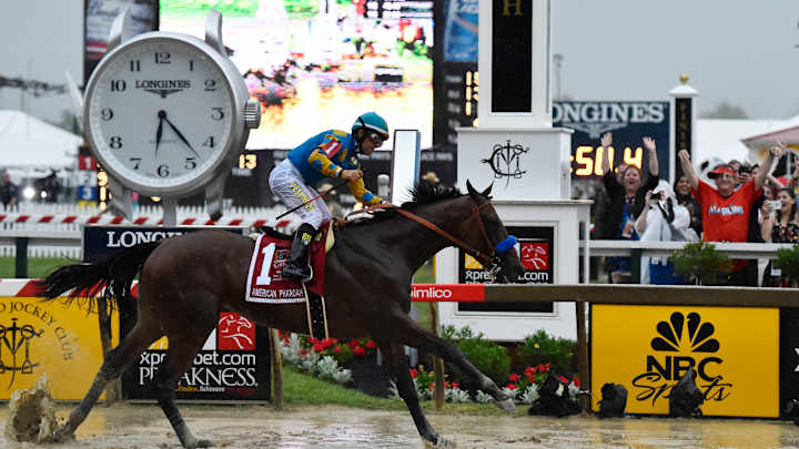 American Pharoah wins Preakness in driving rain