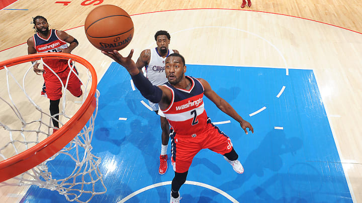 Video: John Wall blows by Matt Barnes with thrilling 360-degree layup
