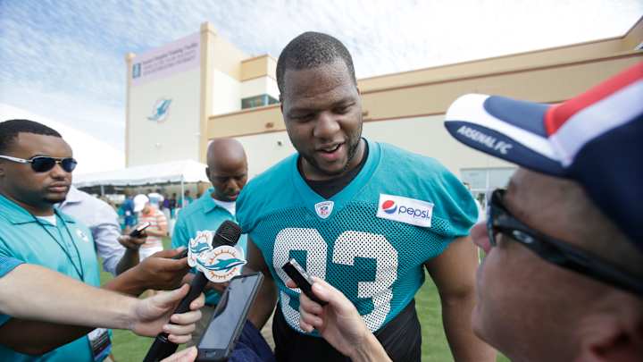 Pads go on at Dolphins camp; Suh finds new gear