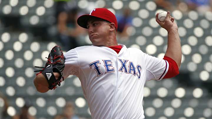 Holland returns as homer-happy Rangers beat Mariners 7-2