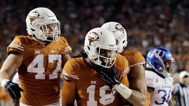 Big plays key Texas romp over winless Kansas 59-20