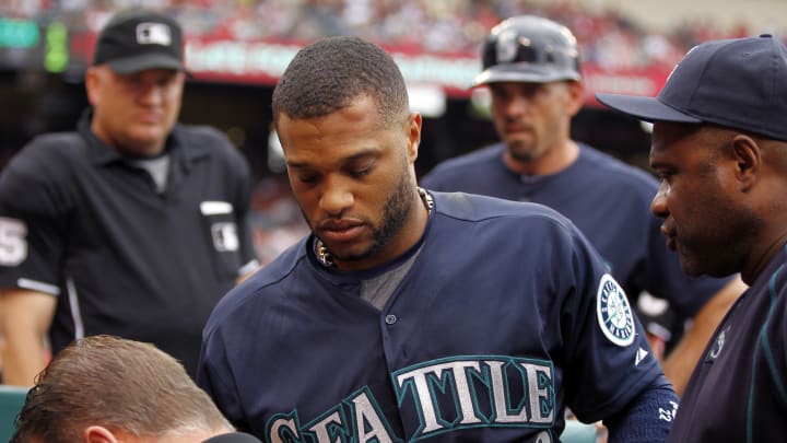 Mariners star Cano injured by warmup ball, Angels win 4-2 Mariners star Cano injured by warmup ball, Angels win 4-2