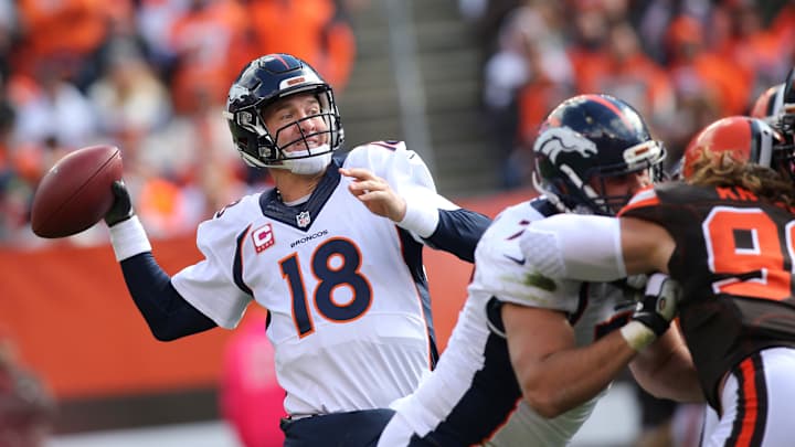 Manning shakes off interceptions, Broncos beat Browns 26-23