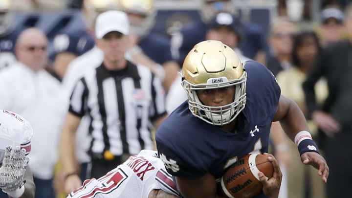 No. 6 Notre Dame overcomes slow start, beats UMass 62-27