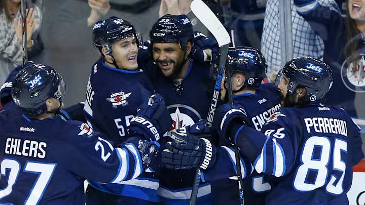 Byfuglien scores late as Jets beat Flames 3-1
