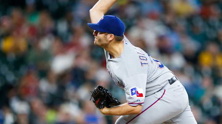 Rangers score 8 times in 11th inning to beat Mariners 11-3