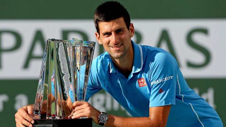 Novak Djokovic caught a Roger Federer return with just his racket