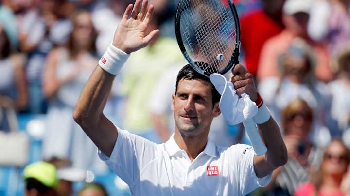 Djokovic romps to straight-sets win over Wawrinka