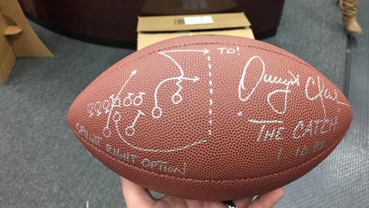 49ers legend Dwight Clark autographs ball with 'The Catch' diagram 49ers legend Dwight Clark autographs ball with 'The Catch' diagram