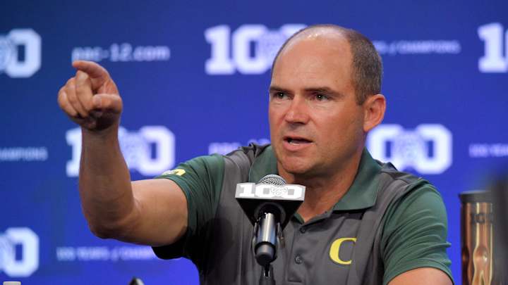 Oregon's Helfrich keeping quiet about new QB as Ducks return