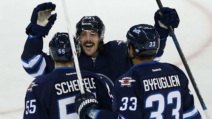 Jets end 6-game skid by beating Canucks 4-1 Jets end 6-game skid by beating Canucks 4-1
