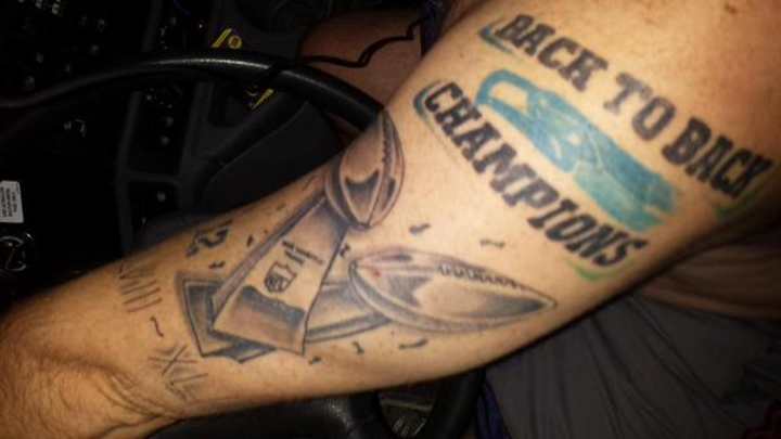 Fan keeping tattoo declaring Seahawks back-to-back champs Fan keeping tattoo declaring Seahawks back-to-back champs