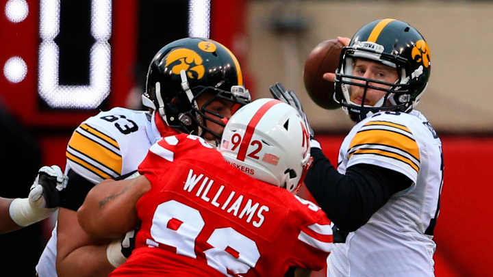 QBs Beathard, Cook clash in Big Ten title game