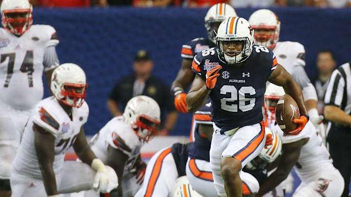 Muschamp defense helps No. 6 Auburn beat Louisville 31-24