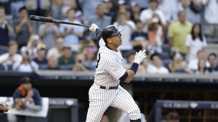 Fan with A-Rod's 3,000th ball holding onto it - for now