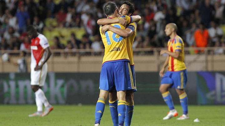 Valencia reaches Champions League group stage despite loss to Monaco Valencia reaches Champions League group stage despite loss to Monaco