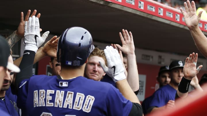 Reds lose 9th straight, Arenado leads Rockies to 5-4 win
