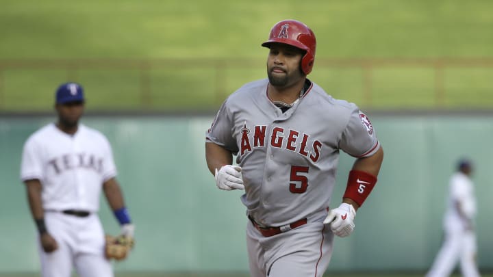 Pujols hits 25th HR, Angels finish sweep of Rangers 12-6