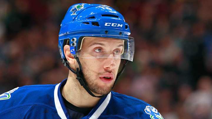 Nick Bonino’s dog Kali models his new Penguins gear