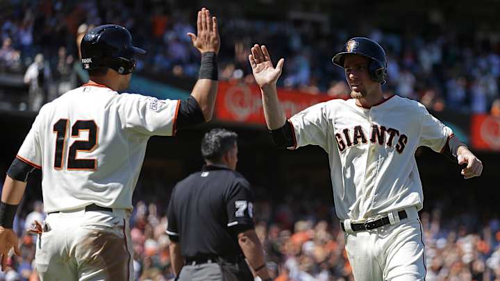 Giants hit 4 triples for 1st time since '60, beat Pads 13-8