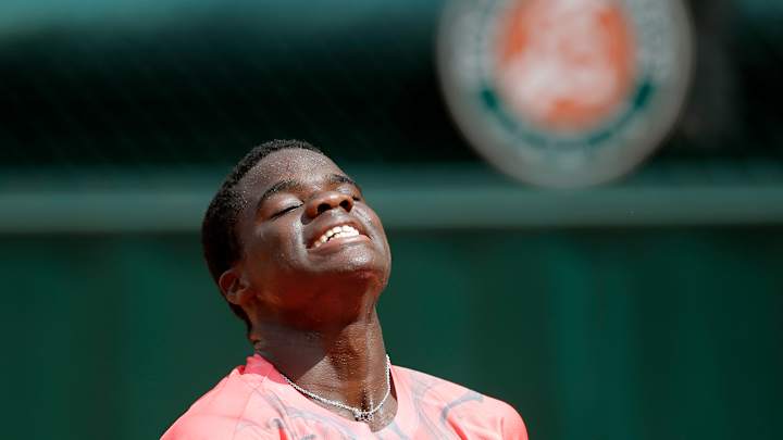 Tiafoe manages to smile after quick loss in Grand Slam debut