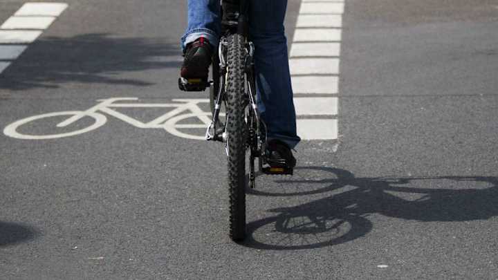 World's strongest bicyclist picks up car blocking bike lane