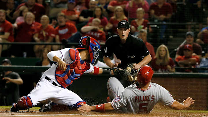 Rangers in playoffs, near AL West title after edging Angels