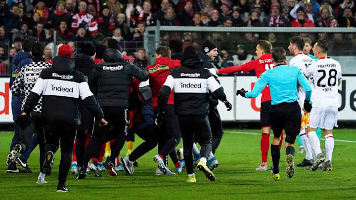 Watch: Eintracht Frankfurt Captain Knocks Over Freiburg Coach to Spark Melee Watch: Eintracht Frankfurt Captain Knocks Over Freiburg Coach to Spark Melee