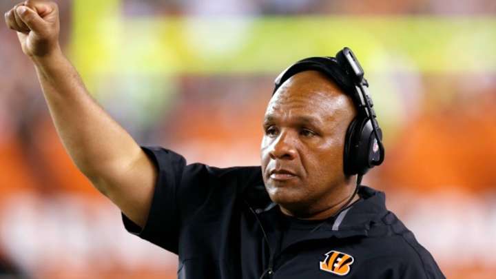 New Bengals offensive coordinator Hue Jackson stands by Andy Dalton
