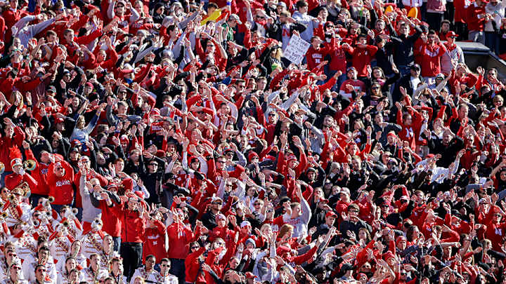 Nebraska fan injured after trying to jump over moving taxi