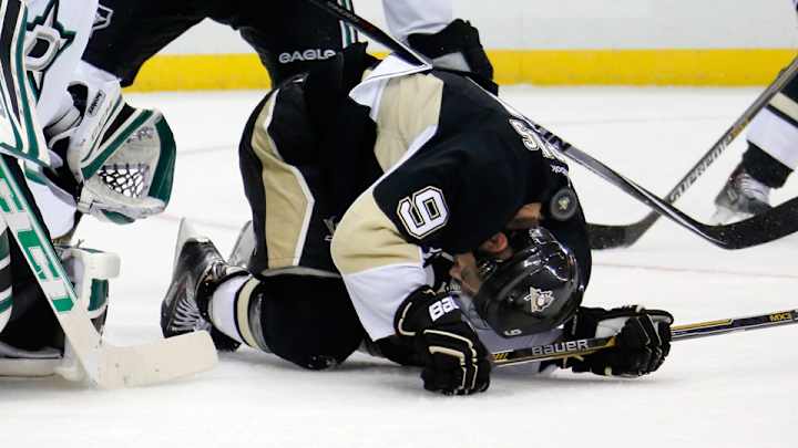 Penguins' Dupuis leaves on stretcher after being hit in the head by shot Penguins' Dupuis leaves on stretcher after being hit in the head by shot