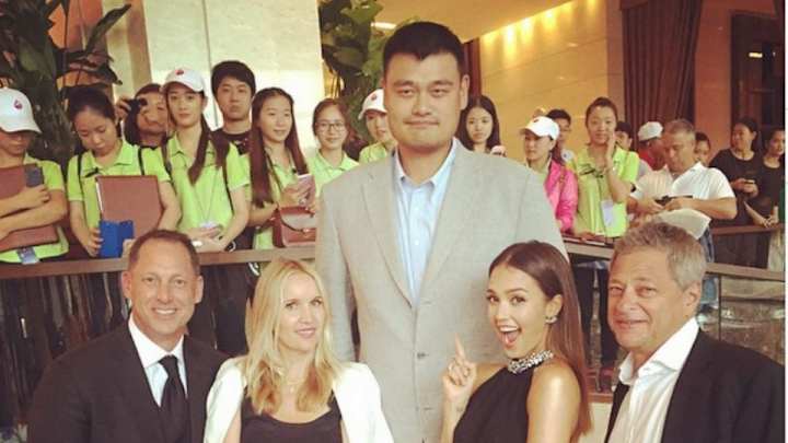 Yao Ming continues being tall next to Jessica Alba,  John Daly
