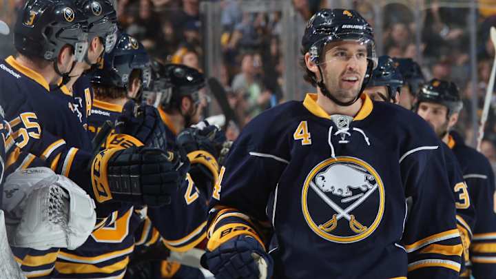 Kings sign Jamie McBain, designate Slava Voynov as non-roster player