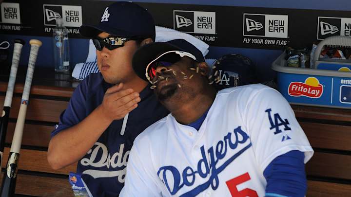 Dodgers pitcher Hyun-jin Ryu wore a hat with Juan Uribe's name on it