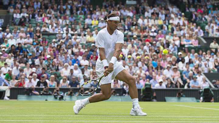 Rafael Nadal recovers after losing the first set to win again at Wimbledon