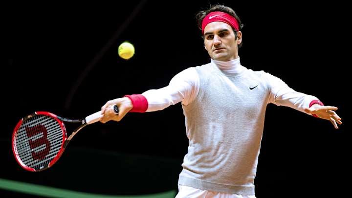 Roger Federer tests injured back during first practice in Lille Roger Federer tests injured back during first practice in Lille