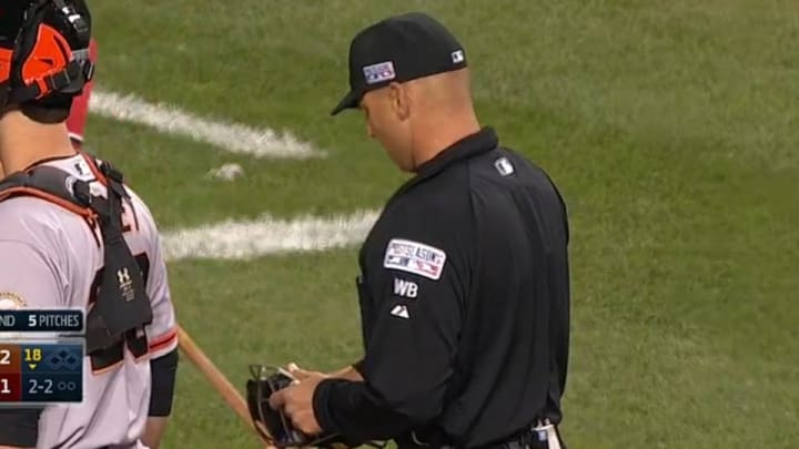 Umpire hit in the head with foul ball, crowd cheers